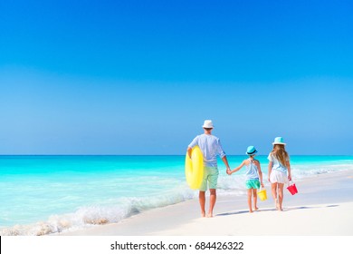 Father And Kids Enjoying Beach Summer Vacation