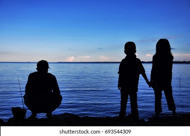  Father And Kids Fishing At Beach