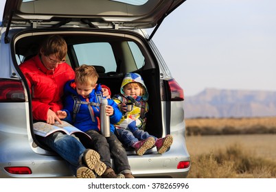 Father With Kids Travel By Car In Mountains