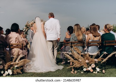 Father Leads The Bride To The Altar