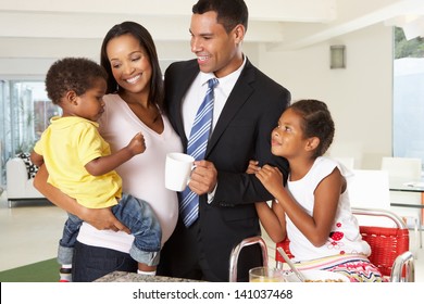 Father Leaving Family Breakfast For Work