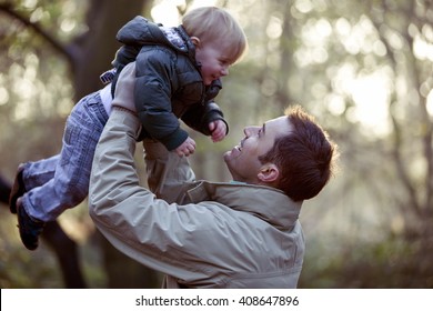 A father lifting his son in the air