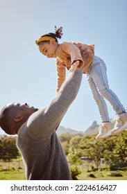 Father Lifting Kid In Air At Park, Garden And Nature Outdoors For Fun, Bonding And Quality Time Together As Black Family. Dad Throwing Girl Child In In Sky While Playing With Love, Care And Relax