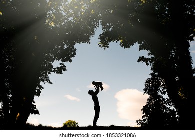 Father Lifting Son Up Silhouette