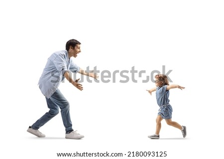 Father and little girl running towards each other to hug isolated on white background