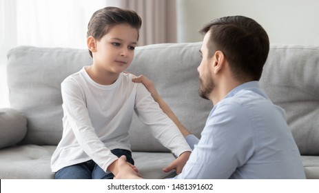 Father And Little Son Having Heart To Heart Talk At Home, Daddy Try To Help Solve Problems Search Solution Together Parent Showing Care And Love Or Older Brother Ask Forgiveness To Younger Boy Concept