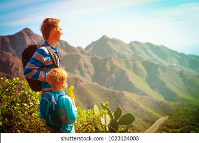 father and little son travel in scenic mountains - Shutterstock ID 1023124003