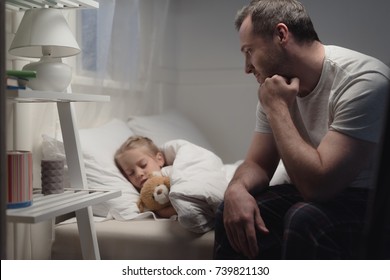 father looking at adorable little daughter sleeping with teddy bear in bed - Powered by Shutterstock