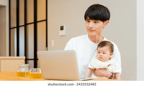 Father male in his 30s who spreads his laptop at home and operates a 0 -year -old baby - Powered by Shutterstock