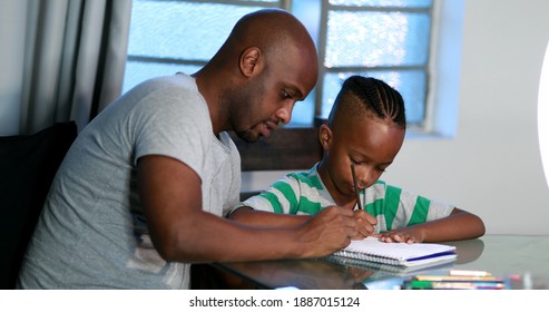
Father mentoring son, dad helping kid with homework study