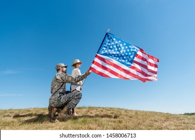 american flag with soldiers