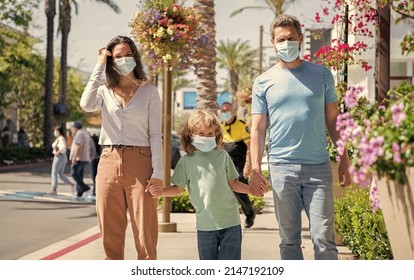 Father Mother And Child In Protective Masks. Family During The Coronavirus Pandemic.