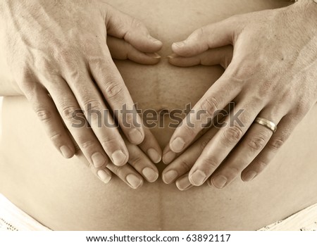 Similar – Image, Stock Photo Top view of hands massaging female abdomen