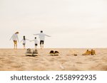 Father, mother and kids take off shoes run on sand beach, Back view of family parents with children fun holding hands together running to beach in holiday, Travel, active lifestyle, Happy family day