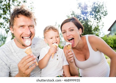 Father, mother and son eating ice cream, sunny summer - Powered by Shutterstock