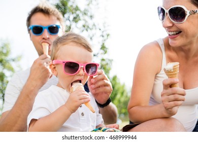 Father, mother and son eating ice cream, sunny summer - Powered by Shutterstock