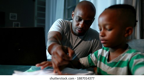 Father Multi-tasking Using Computer Laptop At Home. Candid Authentic And Real Life Dad Working And Parenting