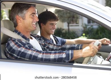 Father On Car Journey With Teenage Son