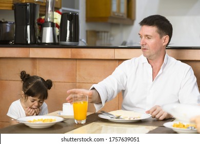 Father And Overbearing Daughter Eating Breakfast Together. Anorexia Child.