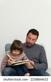 Father painting notebook her
