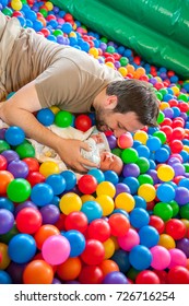 Father Palying With His Son At The Ball Room