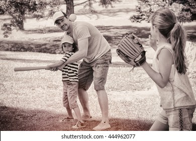 Father Playing Baseball With His Children