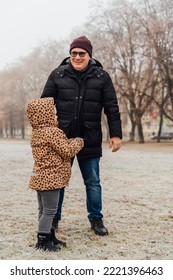 Father Playing With Child Outdoors. Happy Parenting, Family Bond. Toddler Preschool Girl Daughter With Father Lifting Up