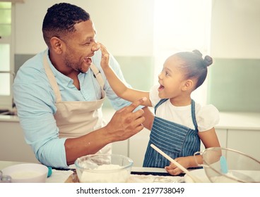 Father, Playing And Girl Baking In Family Kitchen With Flour, Food And Dough While Learning To Bake Cake. Happy Dad Teaching Playful Daughter Cookies Recipe With Excited Young Kid Helping At Home