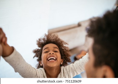 Father playing with his daughter - Powered by Shutterstock