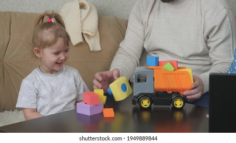 Father Plays With His Little Daughter In Toy Cubes And A Toy Car, The Child Has Fun Indoors With Dad, Color Activities For Kid Autists, Baby Development From An Early Age, Grandfather And