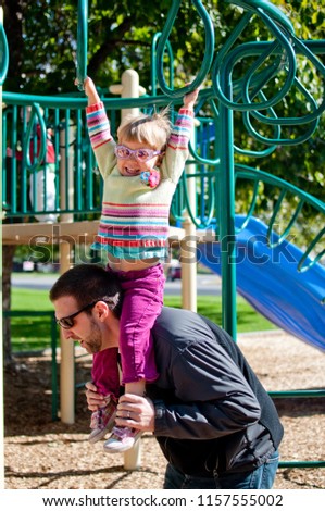 father-plays-playground-daughter-on-450w