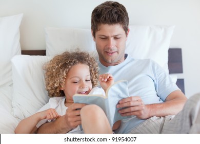 Father Reading A Story For His Child