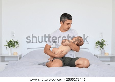 Similar – Man looking his wife and son