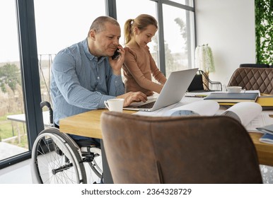 A father, sitting in a wheelchair, works from home, surrounded by his supportive family, including his daughter. Together, they create an atmosphere of unity, sharing moments of joy . - Powered by Shutterstock