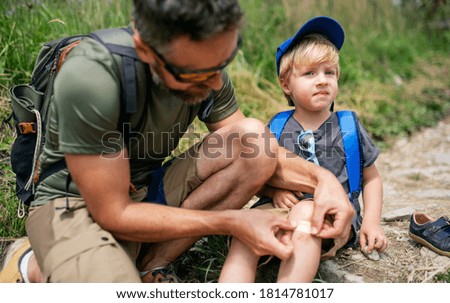 Similar – Foto Bild Kleiner Junge setzt kleines Papierschiff ins Wasser