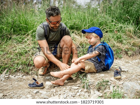 Similar – Foto Bild Kleiner Junge setzt kleines Papierschiff ins Wasser