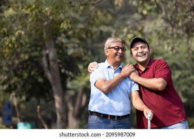Father and son admiring nature at park
