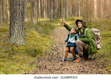 father and son adventure hike. exploring forest together. bonding activities