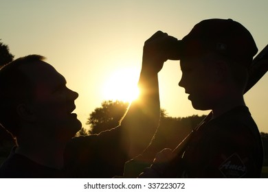 father son silhouette baseball