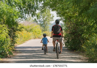 father and son bike riding