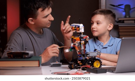 Father and son building robot and developing robotics skills - Powered by Shutterstock