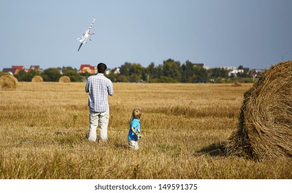 Father And Son Controls RC Plane In The Sky