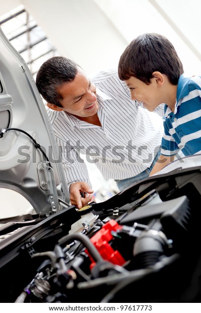 Father and\
son at the dealer looking at a car\
engine