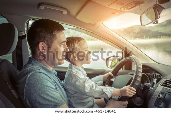 Father and son driving in
car