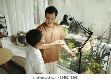 Father and Son Engaging in Indoor Gardening Together - Powered by Shutterstock