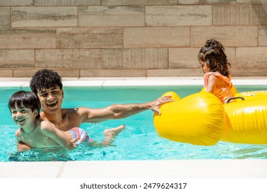 Father and son enjoying a fun swim in the pool while the daughter sits on a yellow duck float, capturing a joyful and playful family moment. - Powered by Shutterstock