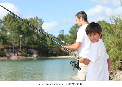 Father and son fishing together in the summertime