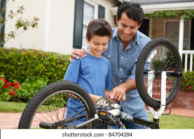 Father And Son Fixing Bike