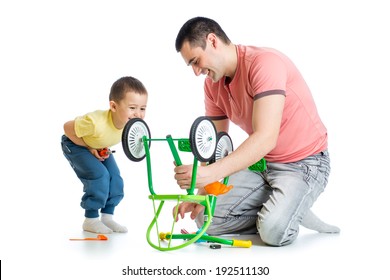  father and son fixing repairing bicycle wheel - Powered by Shutterstock