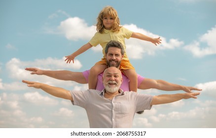 Father, son and grandfather happy multi genration family with aising hands or open arms flying on sky. Generations men.